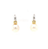 large oval drop papalsey cultured 15 mm white south sea pearl and diamond huggie earring.18 karat white and yellow gold.