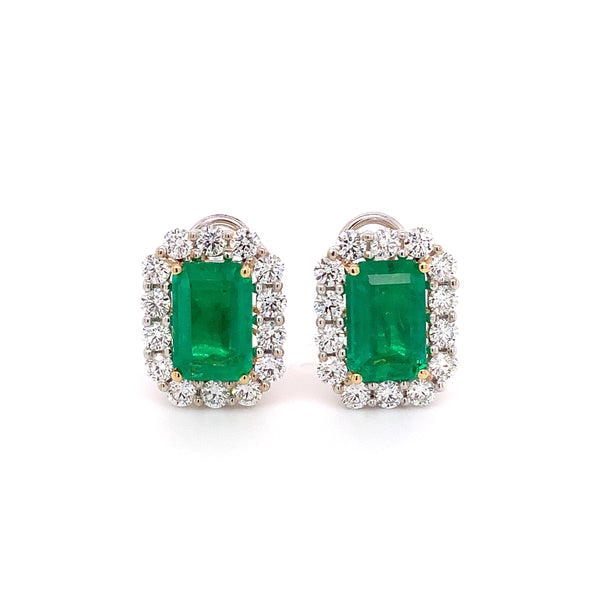 important emerald and diamond halo statement earring handmade in 18 kt white gold.