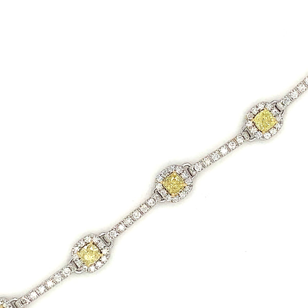 vivid fancy intense yellow cushion cut and white diamond tennis station bracelet 18k white gold