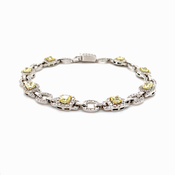 fancy intense yellow cushion shaped and white diamond bracelet set in 18 kt white gold