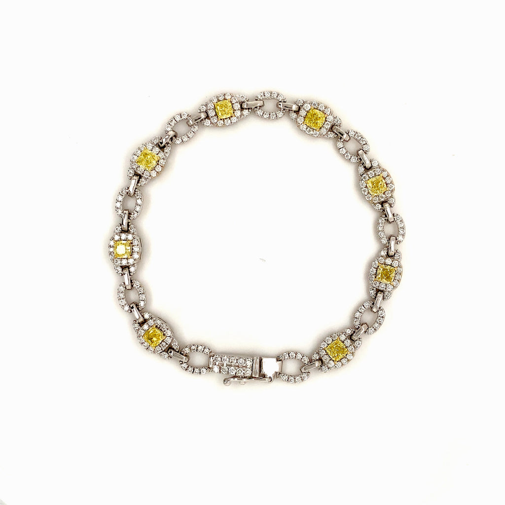fancy intense yellow cushion shaped and white diamond bracelet set in 18 kt white gold