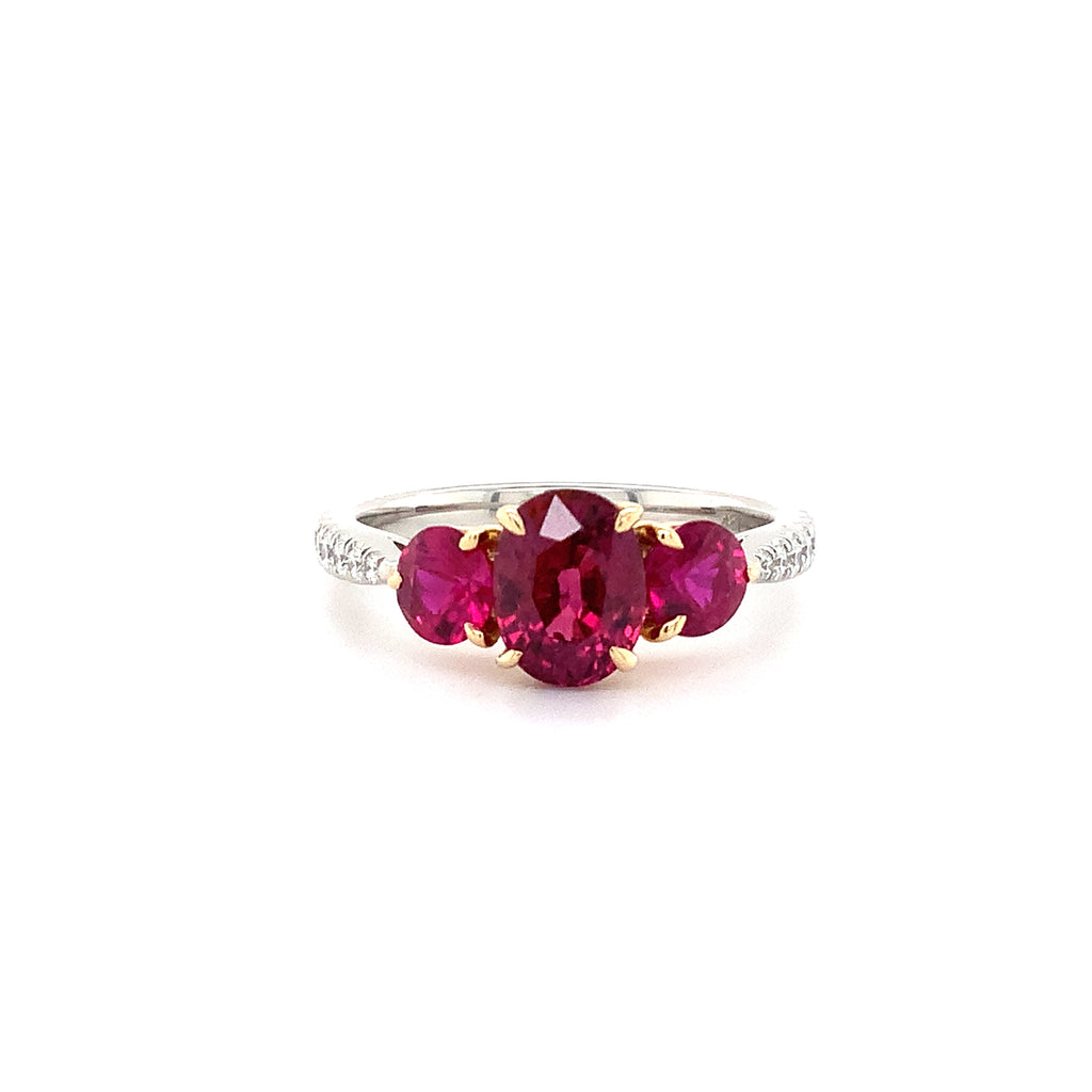 fine oval and round shaped ruby and diamond ring in platinum and 18k yellow gold