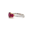 fine oval and round shaped ruby and diamond ring in platinum and 18k yellow gold