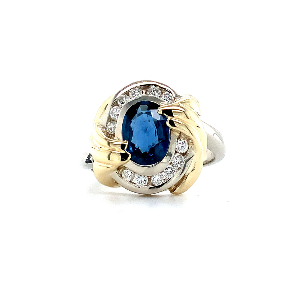 blue sapphire and diamond ring set in 14kt white and yellow gold.