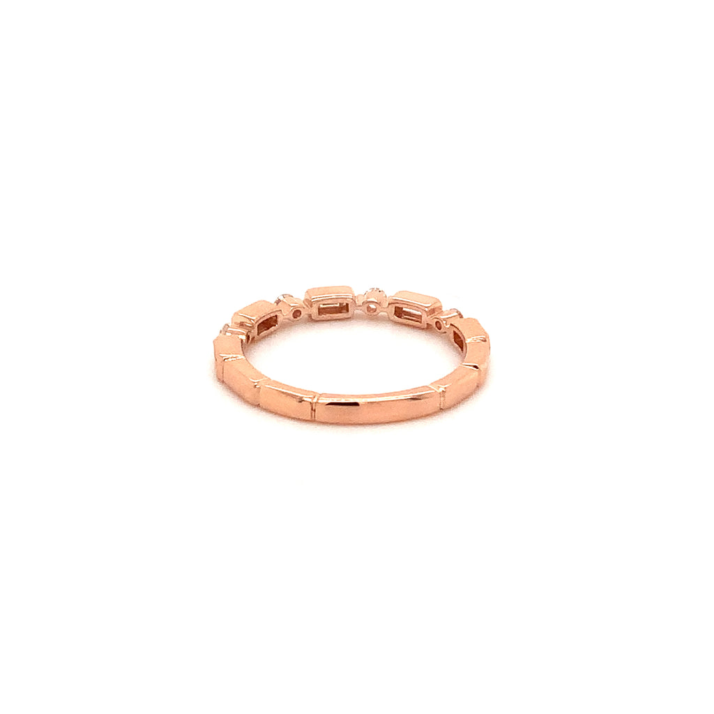 stackable  baguette and brilliant cut diamond band set in 14 kt rose gold.