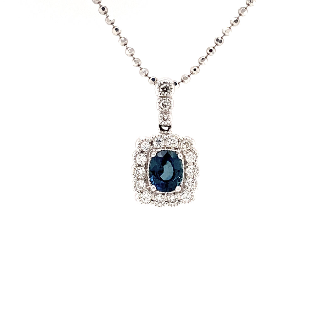 blue sapphire and diamond cushion shaped pendant in 18 kt white gold.
