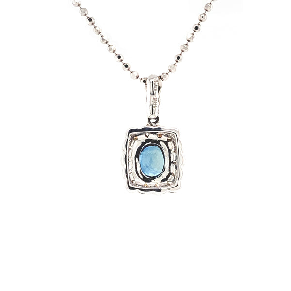 blue sapphire and diamond cushion shaped pendant in 18 kt white gold.