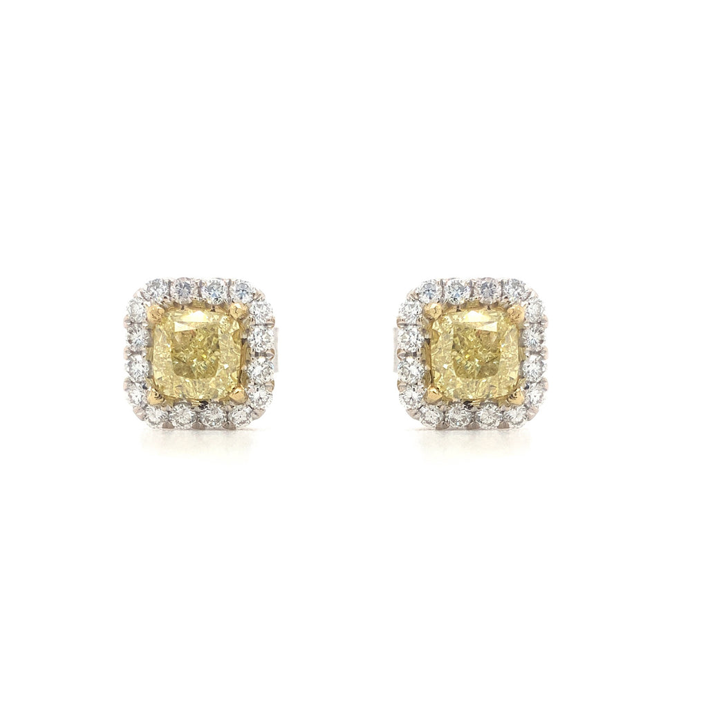 fancy yellow cushion white brilliant diamond halo earring in 18 kt white and yellow gold.