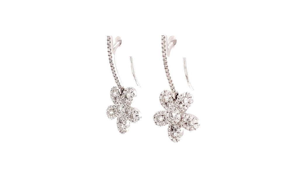 one of a kind diamond flower drop earrings 18 karat white gold.