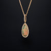 asba collection natural crystal pear-shaped opal pendant with diamond halo in 14k yellow gold