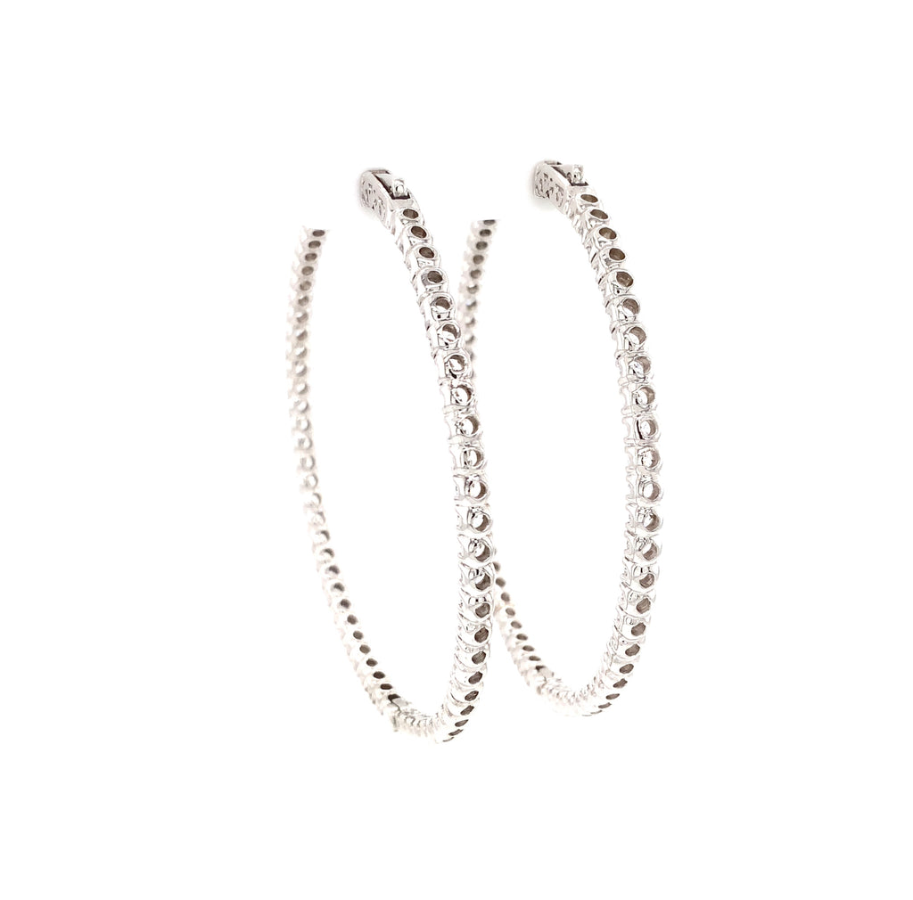 cz inside-out hoop earrings in gold color with secure lock