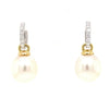large oval drop papalsey cultured 15 mm white south sea pearl and diamond huggie earring.18 karat white and yellow gold.