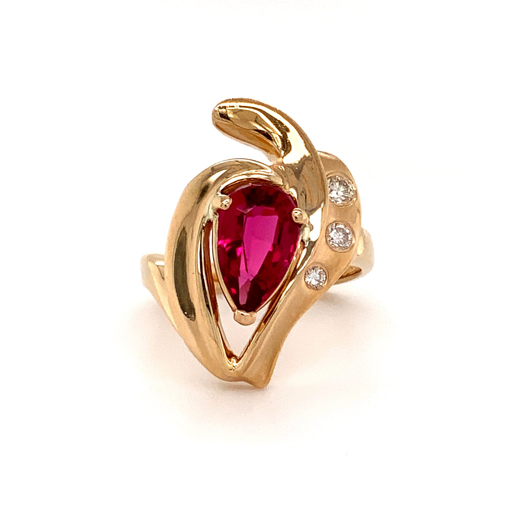 pear shape pink tourmaline (rubelite) and diamond ring in 14 kt yellow gold.