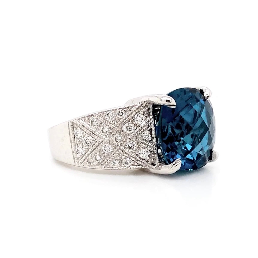 cushion cut super blue topaz and pavée brilliant cut diamond ring 18k white gold