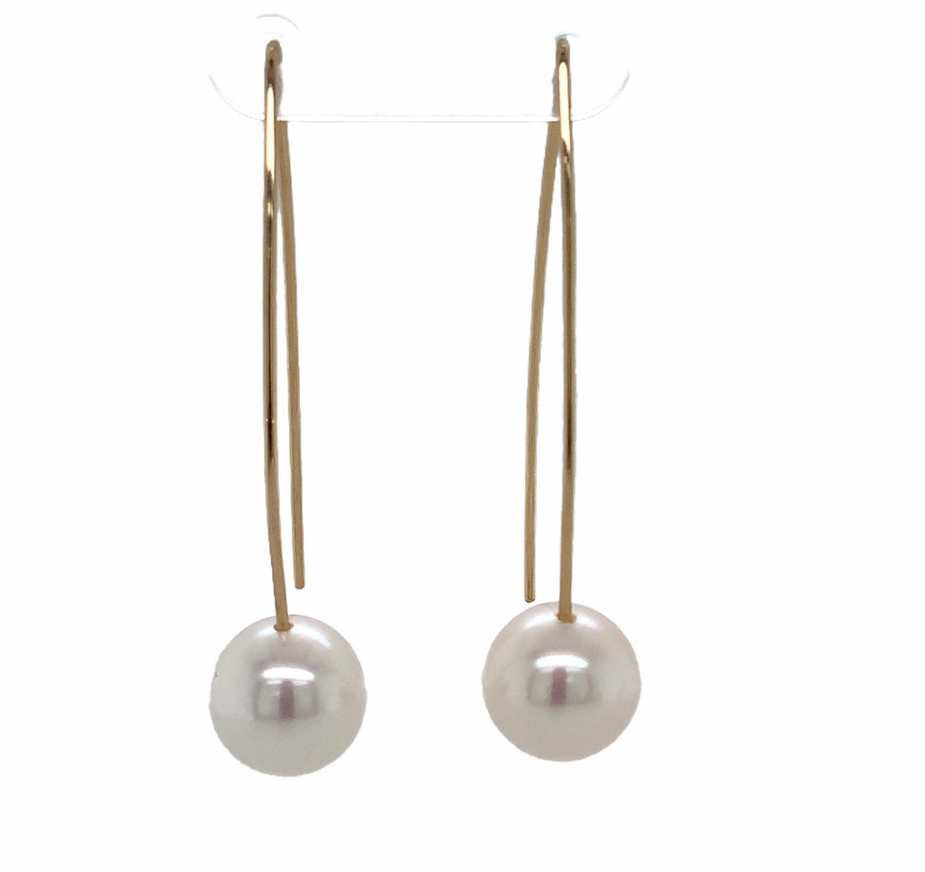 white freshwater pearl on handmade wire drop earrings in 14k of yellow gold