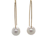 white freshwater pearl on handmade wire drop earrings in 14k of yellow gold