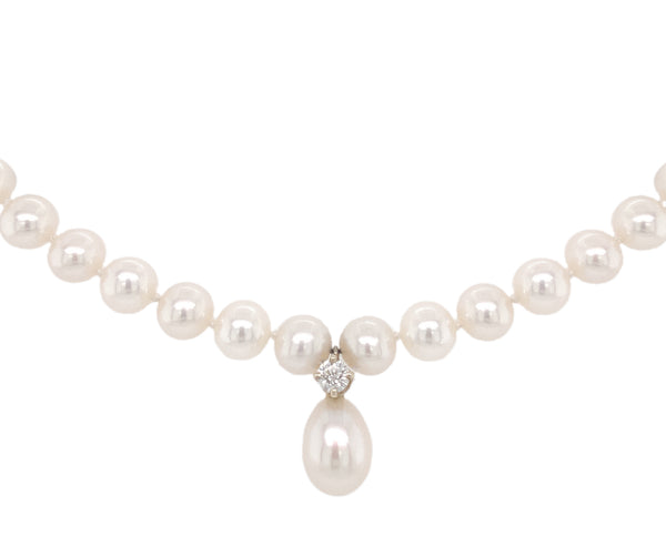 white freshwater pearl and diamond drop necklace.