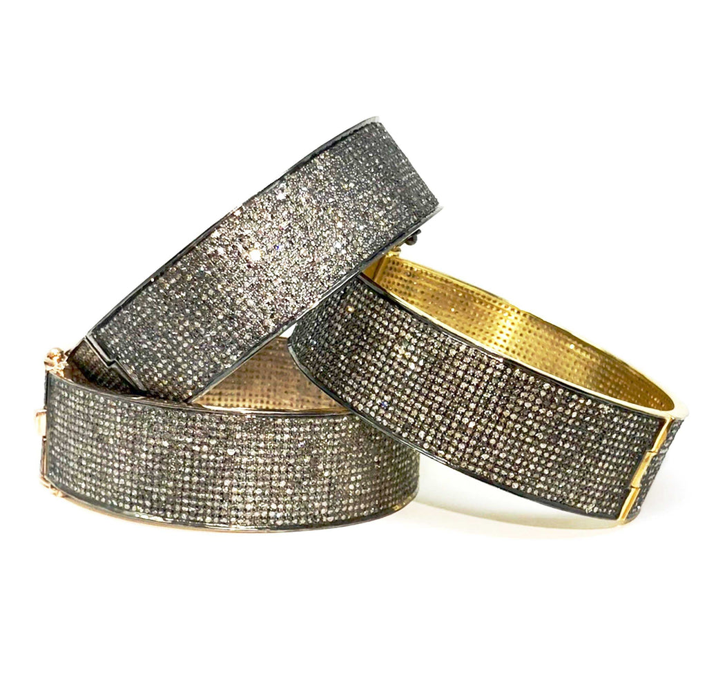 twelve carat total weight diamond paved bangle bracelet round shape.